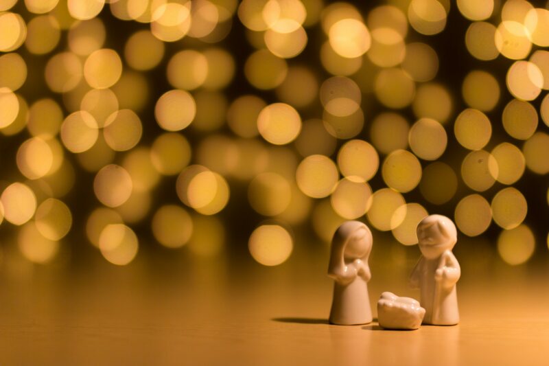 A nativity scene with Christmas lights